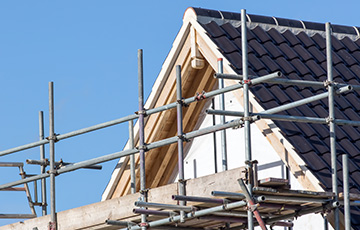 Scaffolding erected near a home that's being built